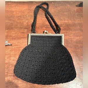 Vintage Italian Black Woven Handbag with Braided Strap and Coin Purse Closure.